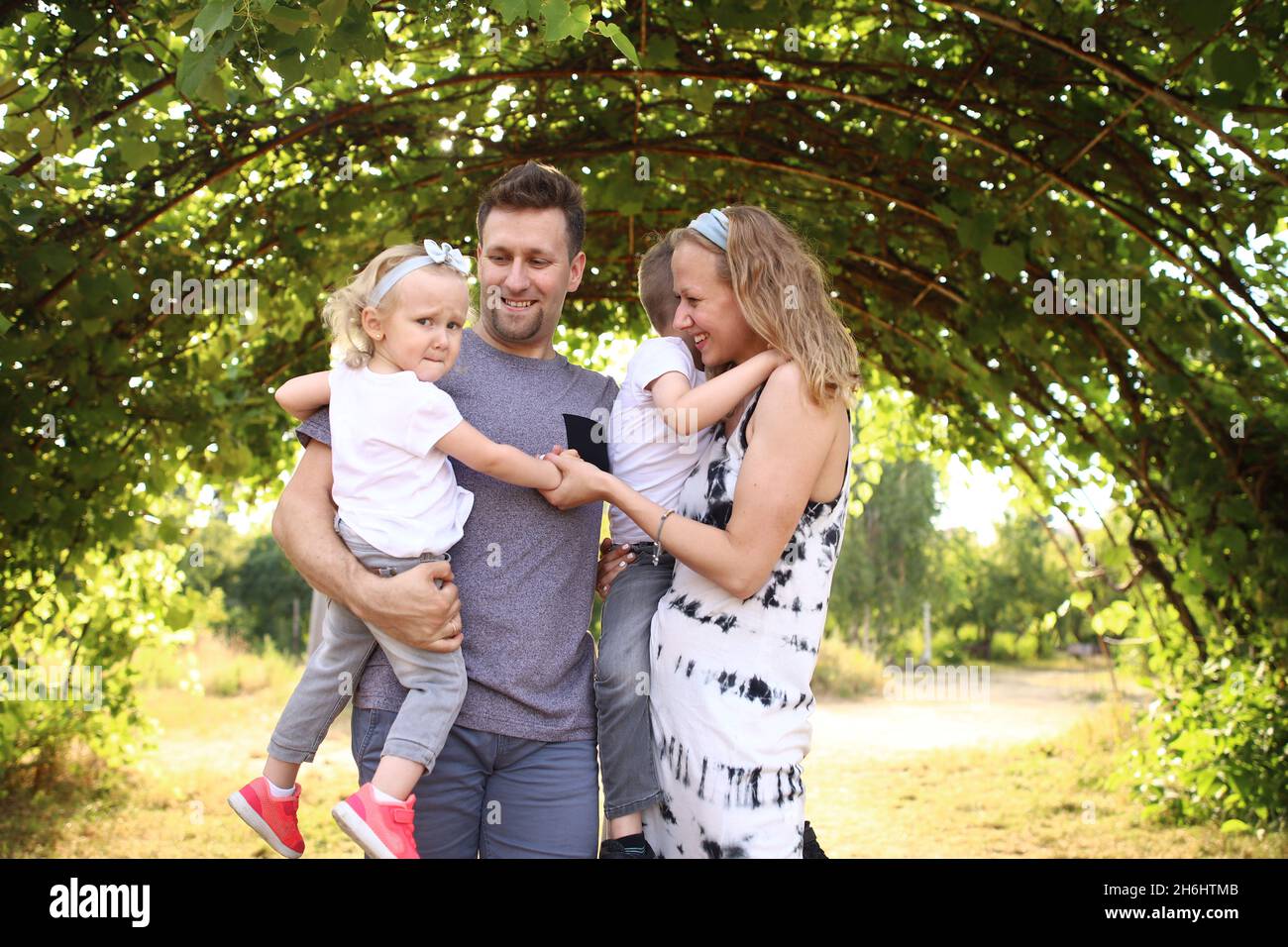 Happy loving family with two children, son and daughter playing and ...
