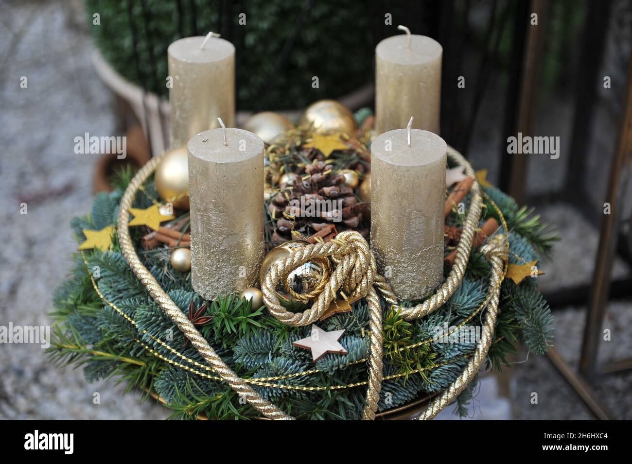 Christmas decoration in interior. An advent wreath with four golden candles Stock Photo