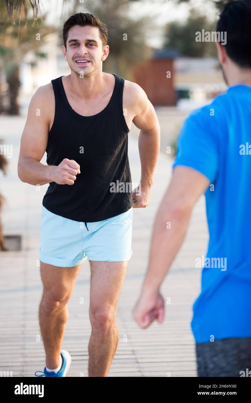 Two male friends practice for race Stock Photo - Alamy