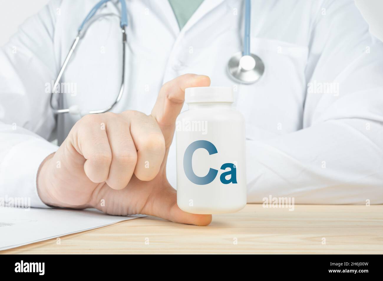 Calcium Ca supplements for Bone human health. Doctor taking