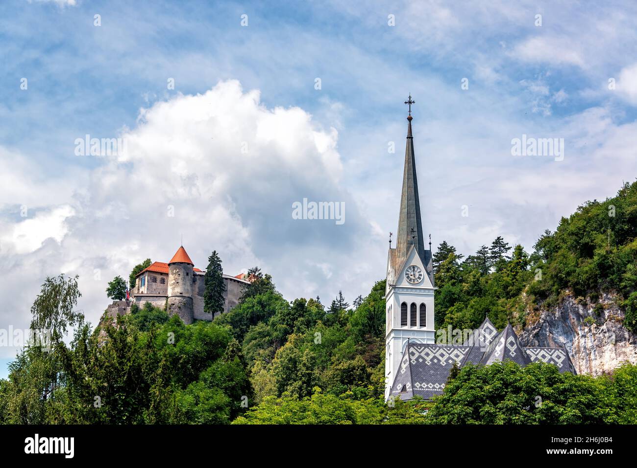 View of a church and Bled Castle in Slovenia Stock Photo