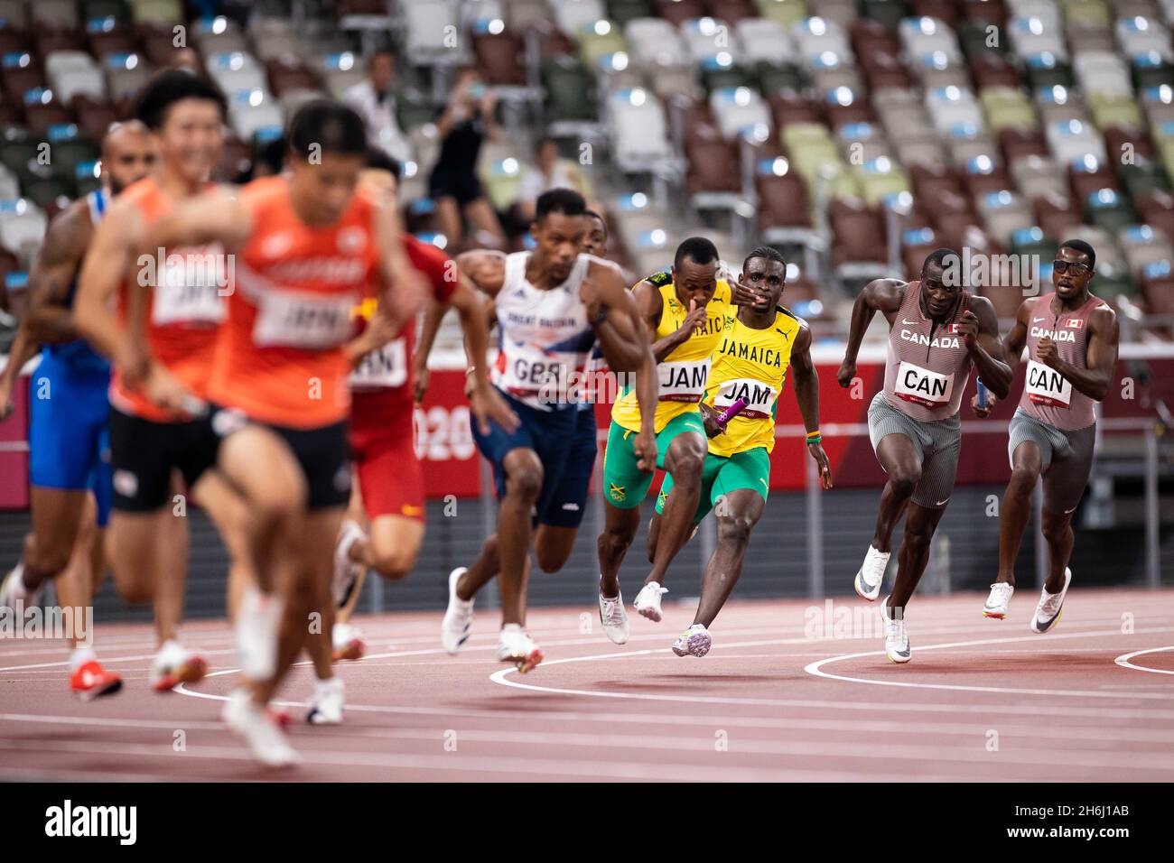 Zharnel Hughes of Great Britain runs the third leg of the 4x100m Final in the Tokyo 2020 Olympic Games. Stock Photo