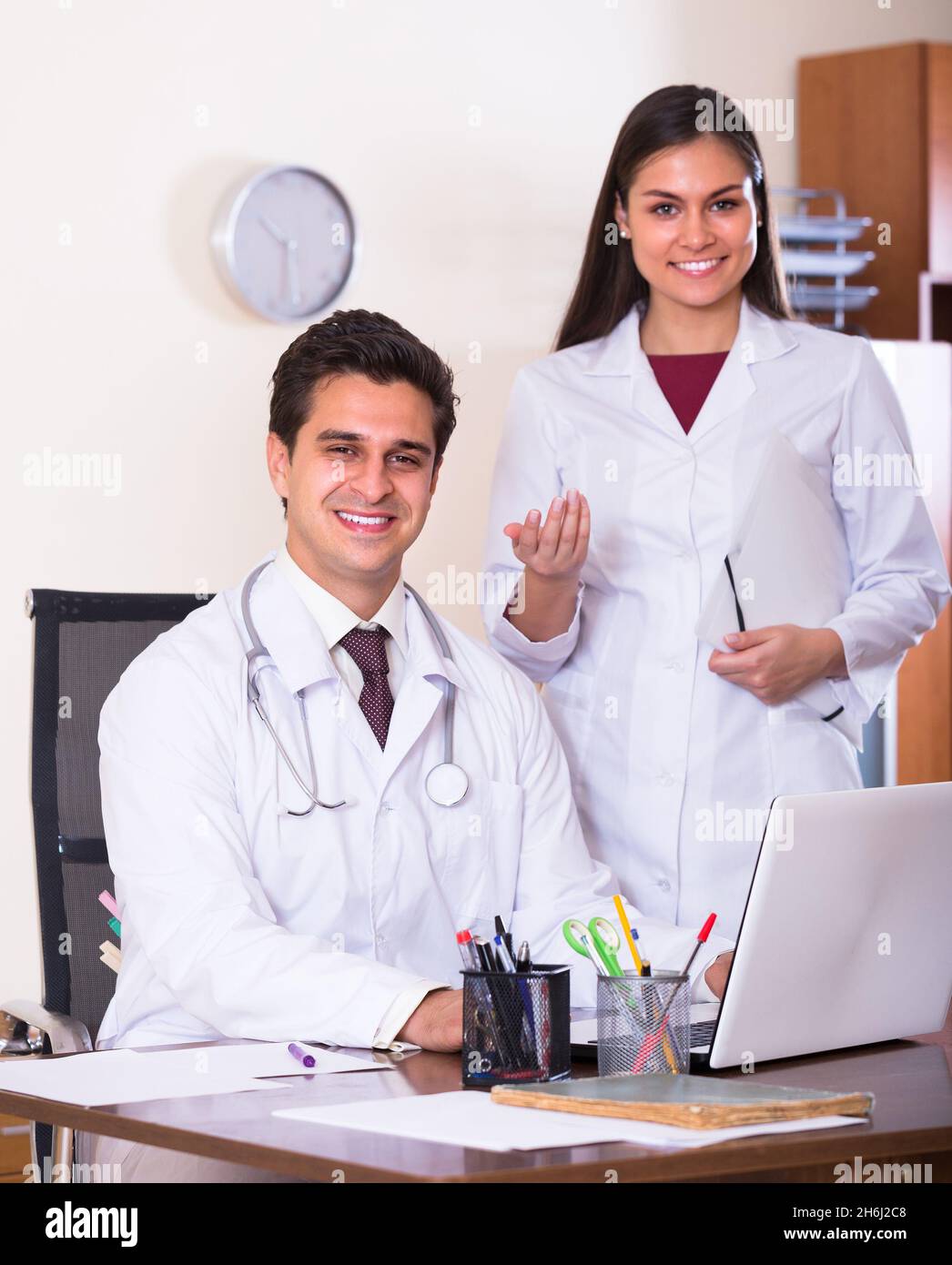 Two doctors in private clinic . Stock Photo