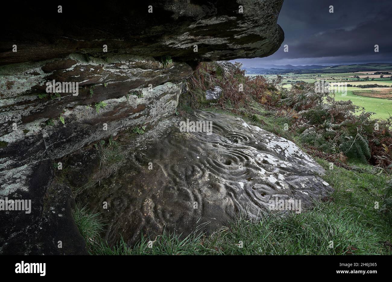 Ketley Crag Rock Shelter Northumberland on a cloudy wet day Stock Photo