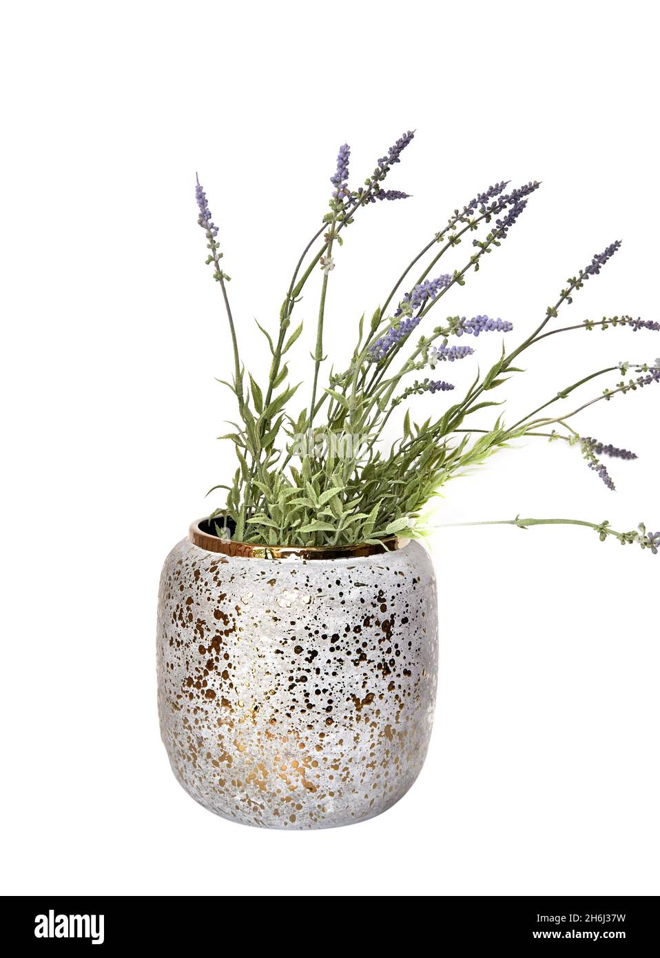 Decorative ceramic vase. Beautiful floral arrangement of af artificial plant in flower pot on light grey marble table. Stylish Interior home design Stock Photo