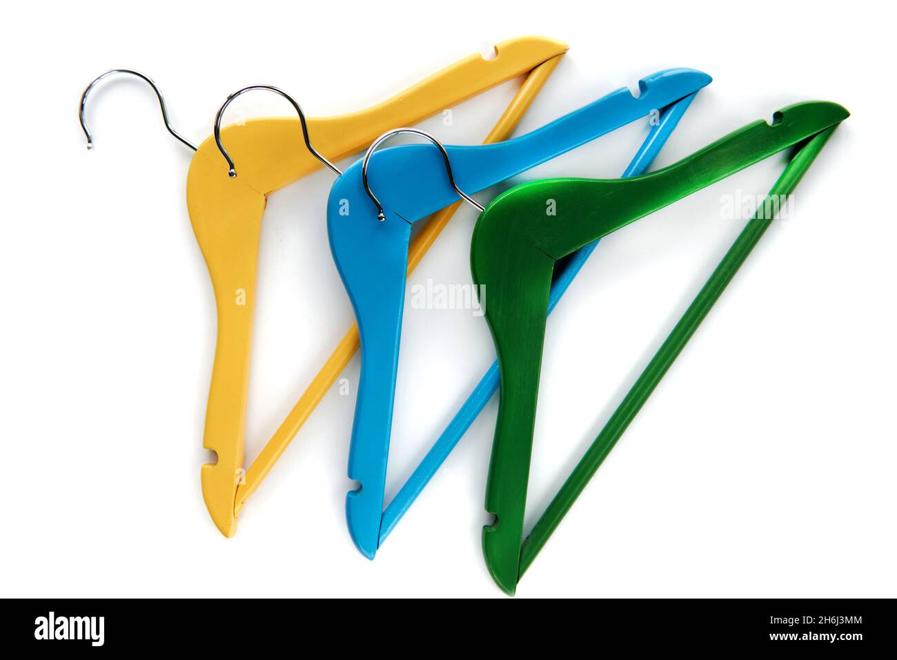 Wooden Coat hangers with black paper label isolated on white background. Clothing tag, label