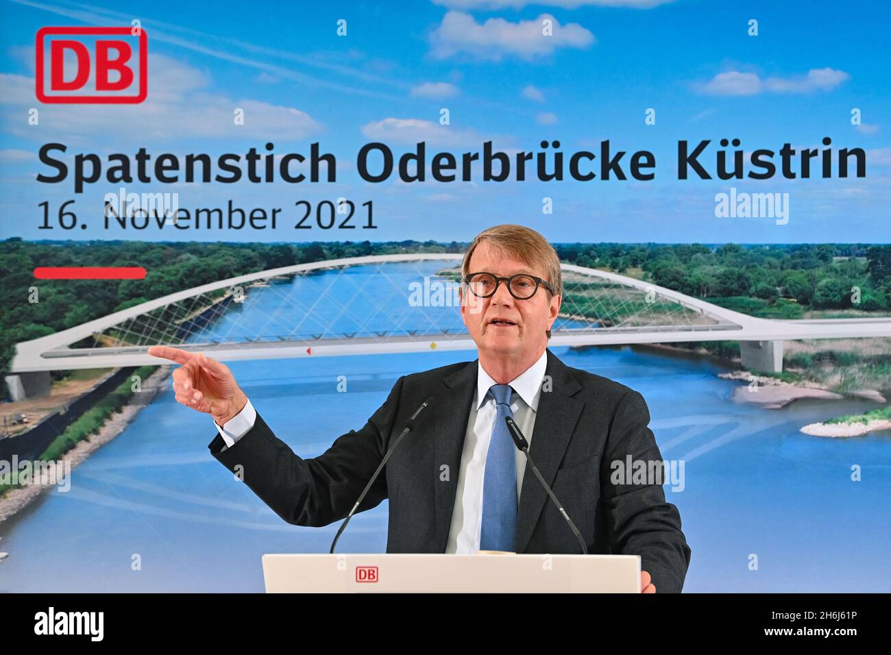 16 November 2021, Brandenburg, Küstrin-Kietz: Ronald Pofalla, Member of the Board of Management of Deutsche Bahn, speaks at the laying of the foundation stone for the railway bridge over the German-Polish border river Oder. The federal government is investing around 65 million euros in the construction. According to its own information, the new railway bridge is unique worldwide. The 260-meter-long network arch bridge's supporting cables, the so-called hangers, are made of carbon. The material, which is significantly more elastic than steel, and the innovative construction technology enable a Stock Photo