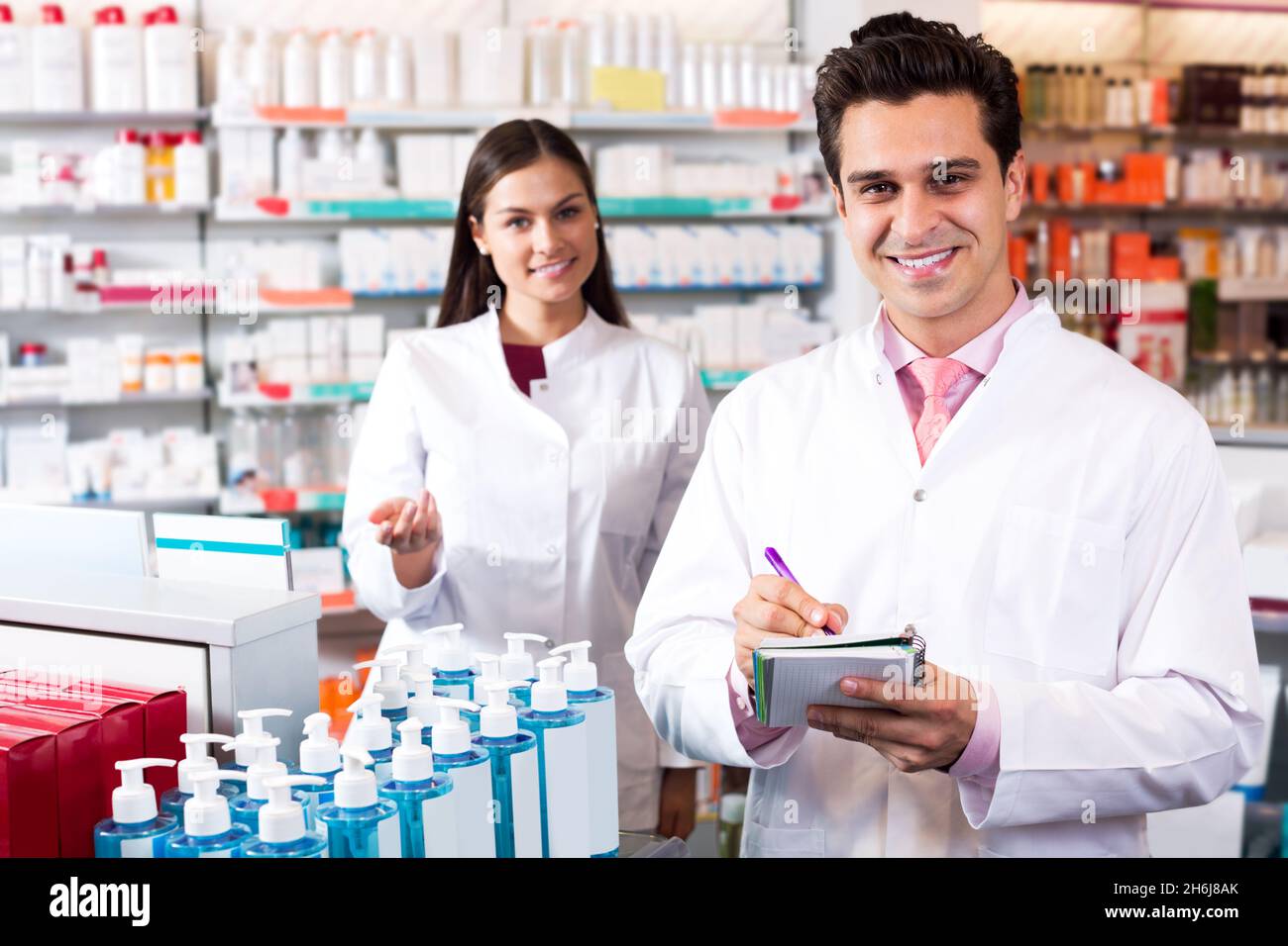 Portrait of two friendly pharmacists working Stock Photo