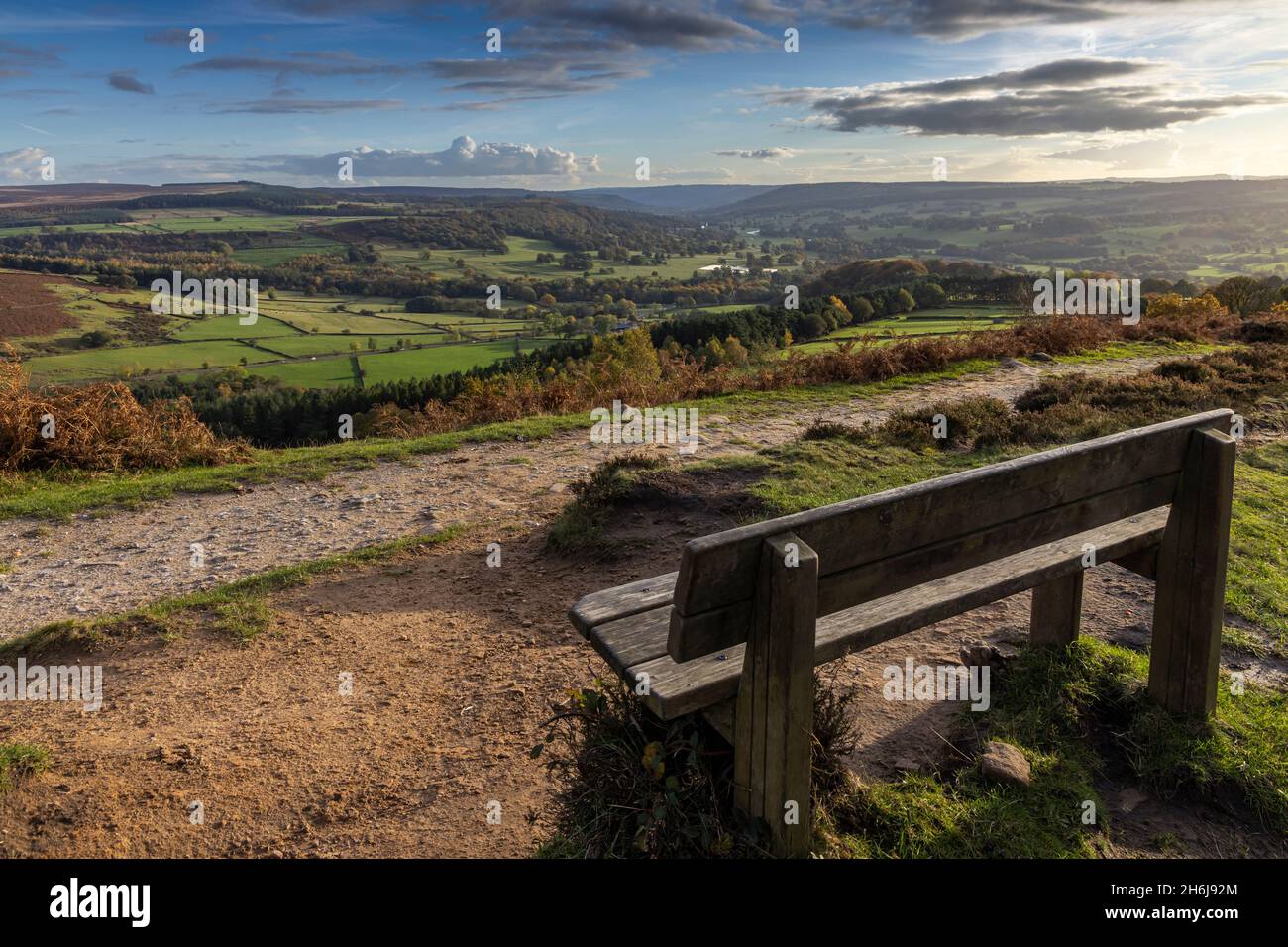 A view down the Derwent Valley to Chatsworth House can be found from this bench situated at the end of Baslow Edge in the Peak District National Park. Stock Photo