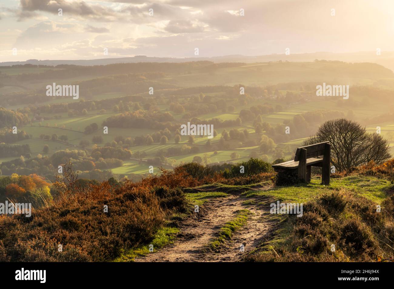 A view down the Derwent Valley and Chatsworth Park can be found from this bench situated at the end of Baslow Edge in the Peak District National Park. Stock Photo