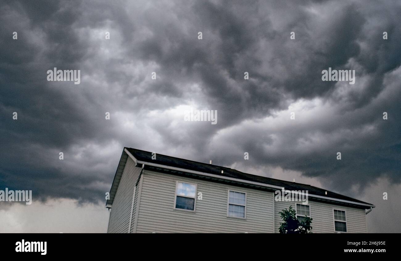 Stormy Skies over Neightborhood Home Stock Photo