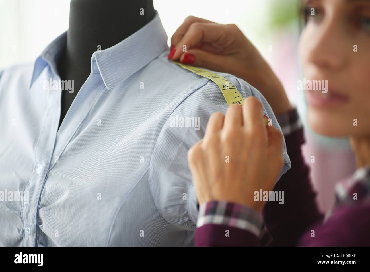 Student is being trained to seamstress or fashion designer Stock