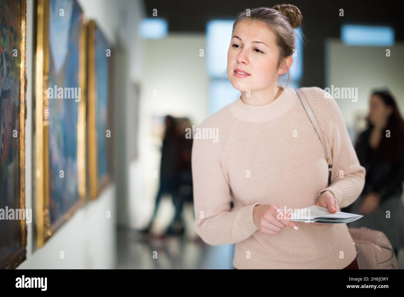 Girl holding book painting hi-res stock photography and images - Alamy