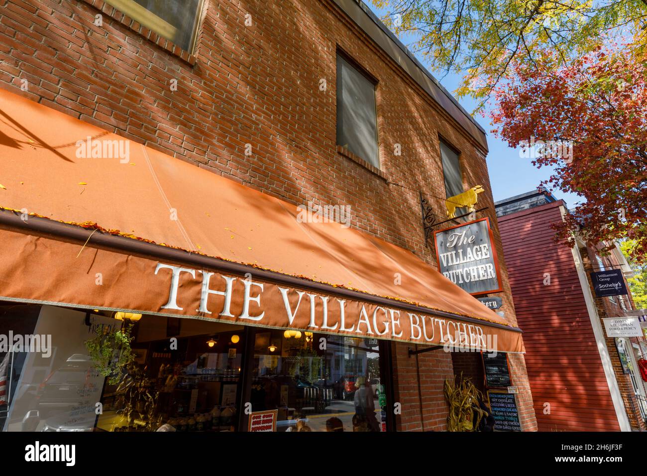 Brown awning above the shopfront of local deli 'The Village Butcher' in Woodstock, Vermont, New England, USA Stock Photo