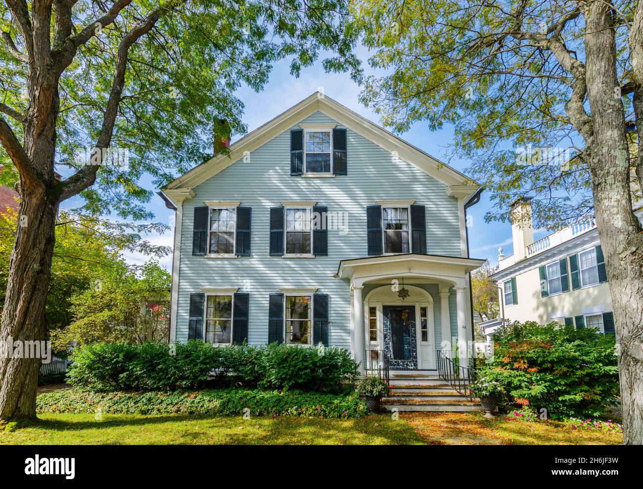 Typical local style light blue painted clapboard faced house in Woodstock, Vermont, New England, USA Stock Photo