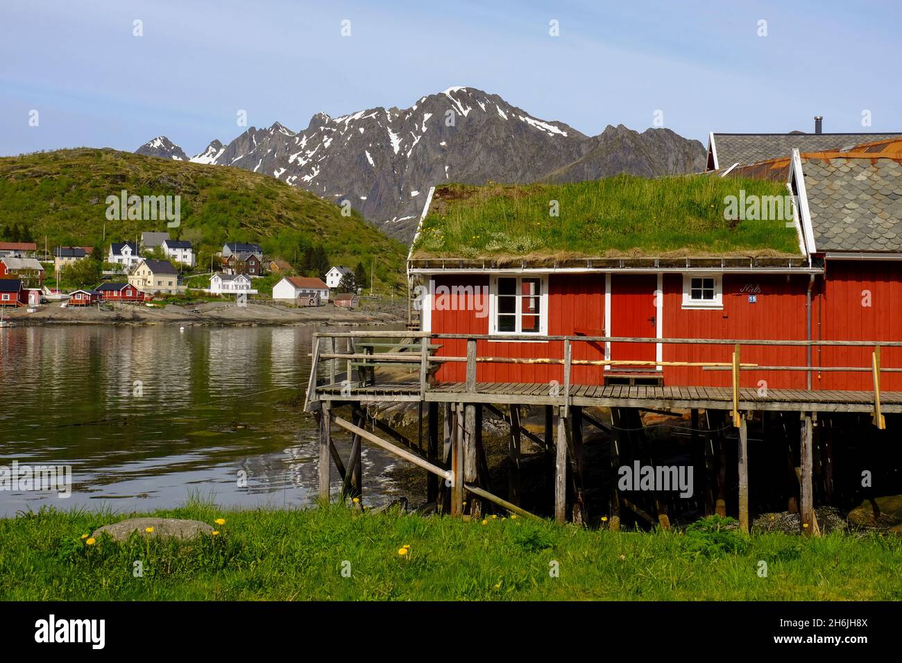 Traditional turf roofs and red buildings in the charming cod fishing village of Reine, Lofoten Islands, Nordland, Norway, Scandinavia, Europe Stock Photo