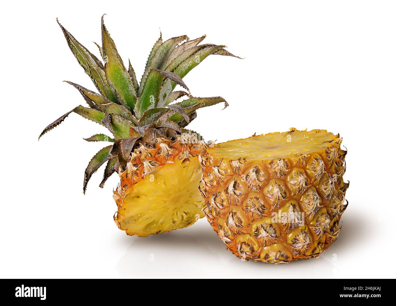 Cut in half pineapple isolated on white Stock Photo