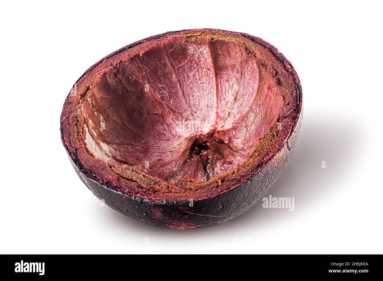 Dark purple mangosteen shell isolated on white Stock Photo