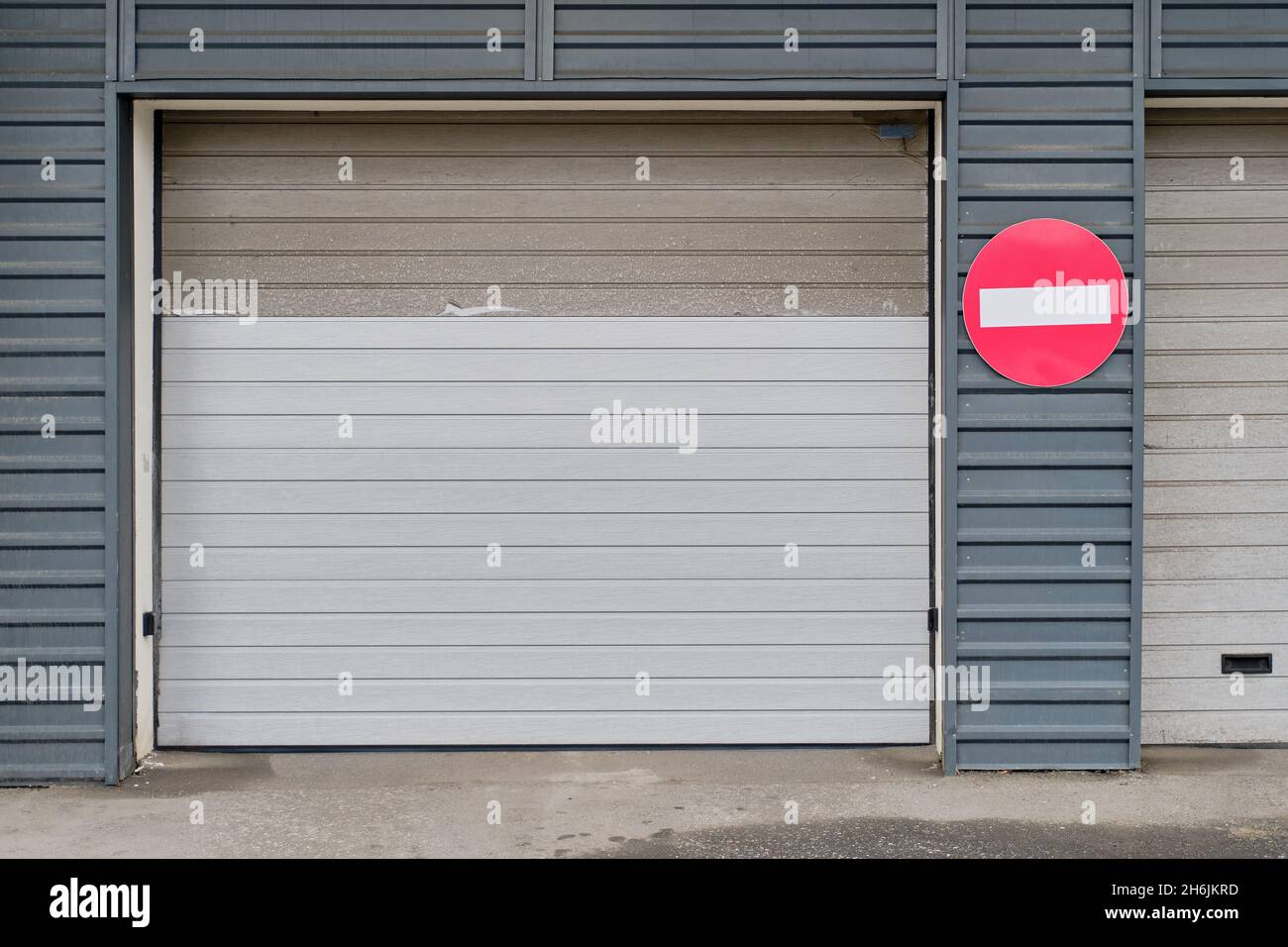 Garage doors repaired after the accident, repainted lifting doors for