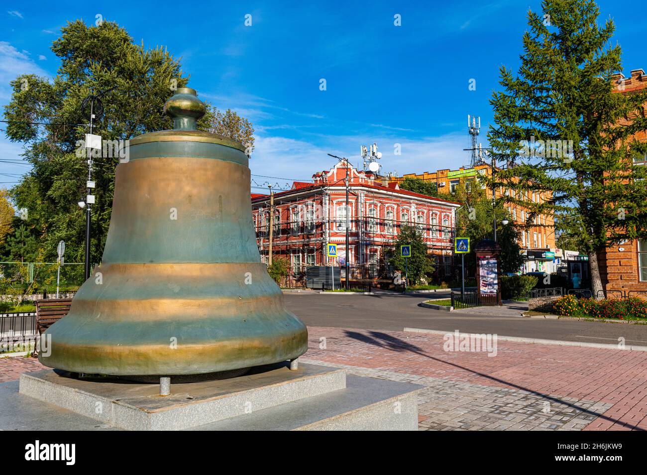 Old bell in front of Historic buildings, Minusinsk, Krasnoyarsk Krai, Russia, Eurasia Stock Photo