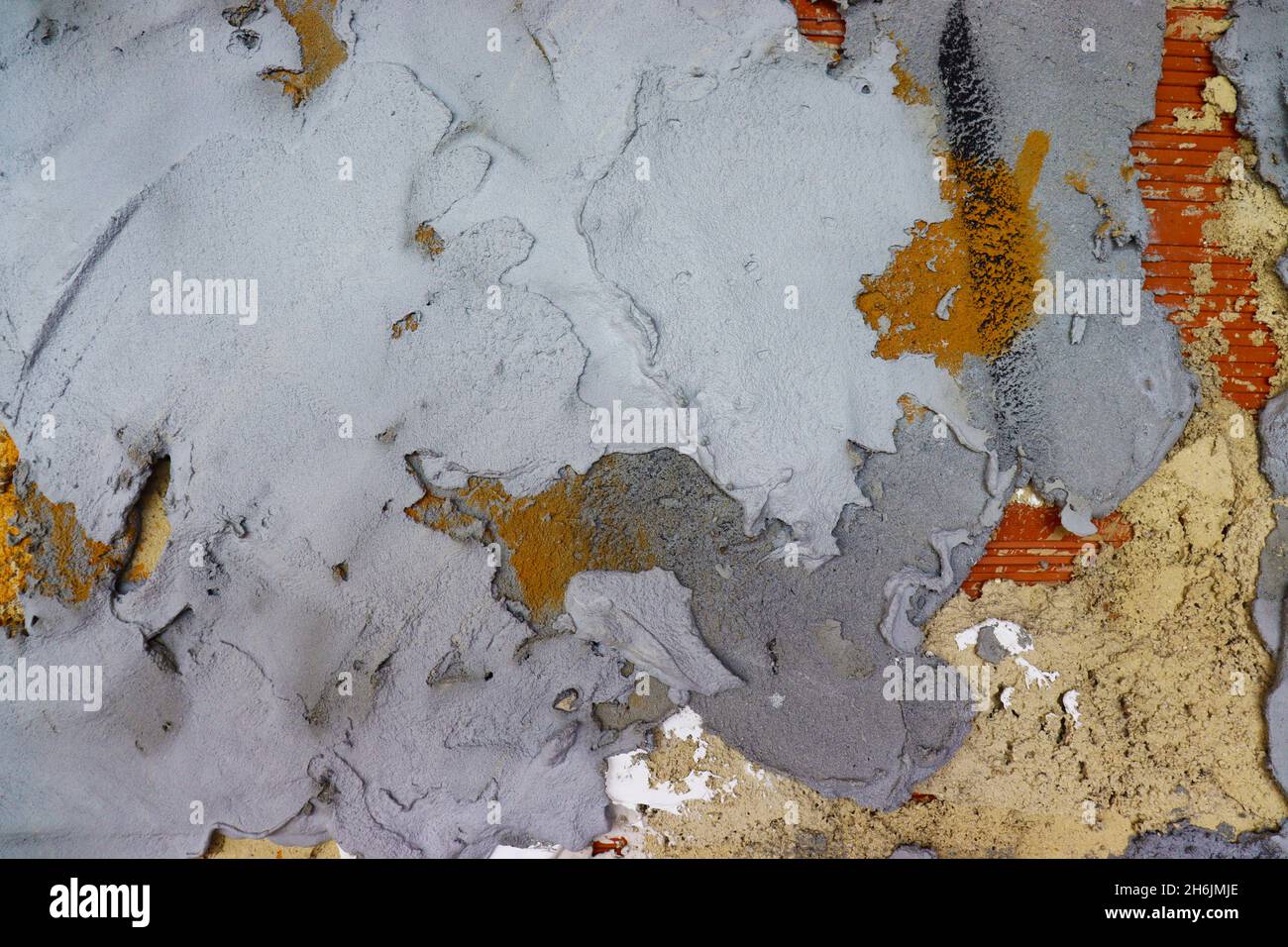 Wall texture with different kinds of cement, showing bricks on the