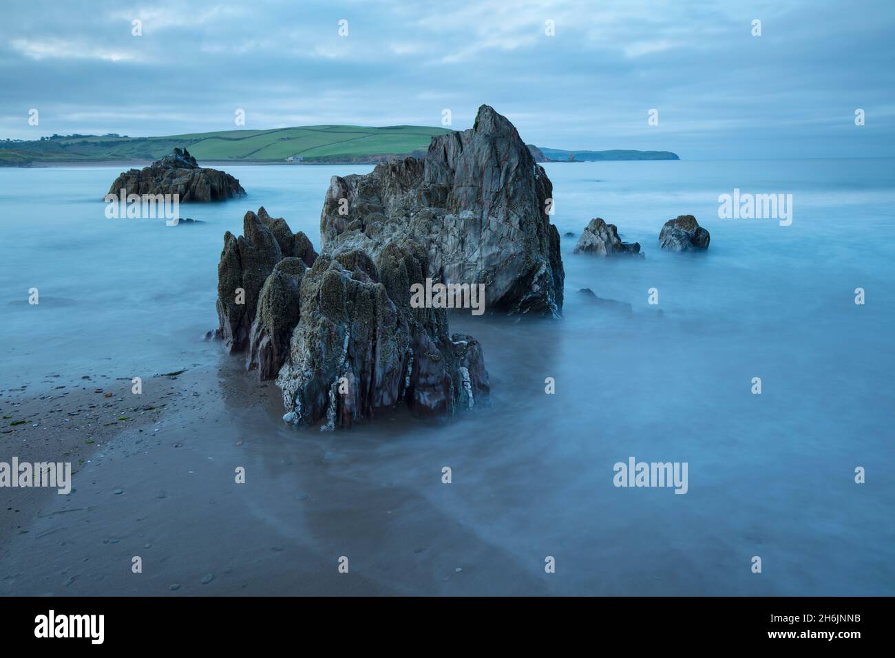 Rocks on beach at low tide at dawn, Bigbury-on-Sea, Devon, England, United Kingdom, Europe Stock Photo