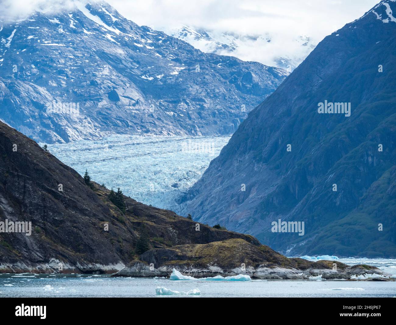 Retreating tidewater South Sawyer Glacier meets the rock, Tracy Arm, Southeast Alaska, United States of America, North America Stock Photo