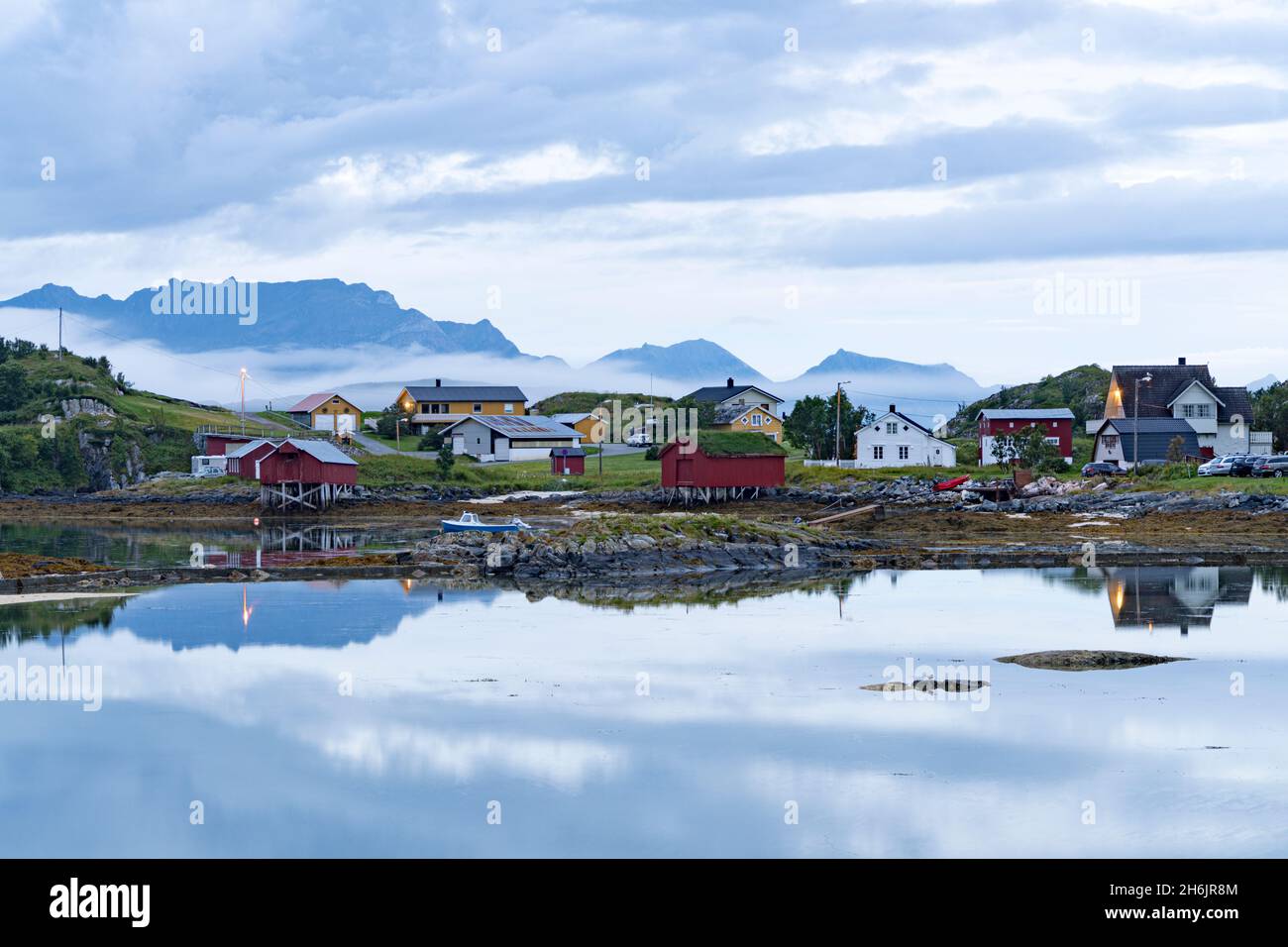 Dusk over the fishermen's red cabins by the Arctic sea, Sommaroy, Tromso, Troms county, Northern Norway, Scandinavia, Europe Stock Photo
