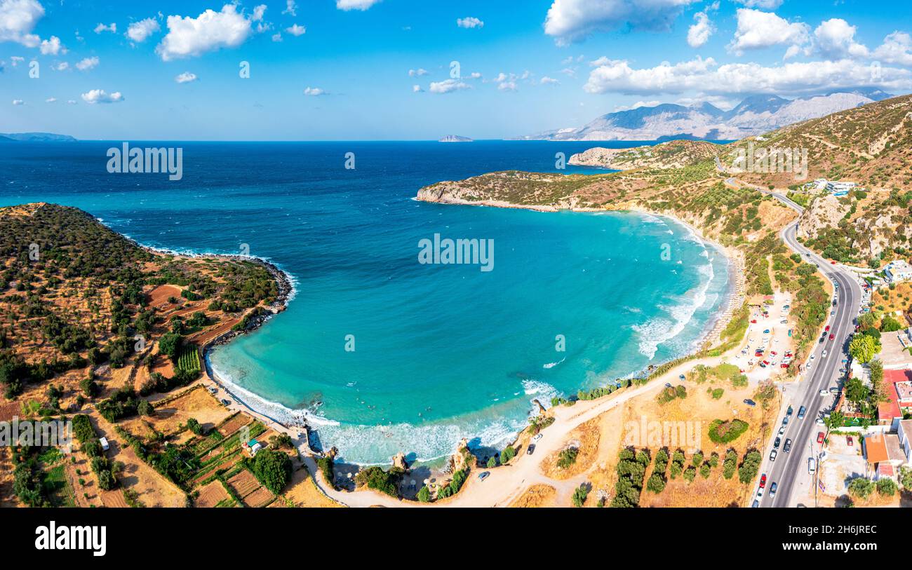 Aerial view of Almyros Beach washed by the turquoise sea in the gulf of Mirabella, Agios Nikolaos, Crete island, Greek Islands, Greece, Europe Stock Photo