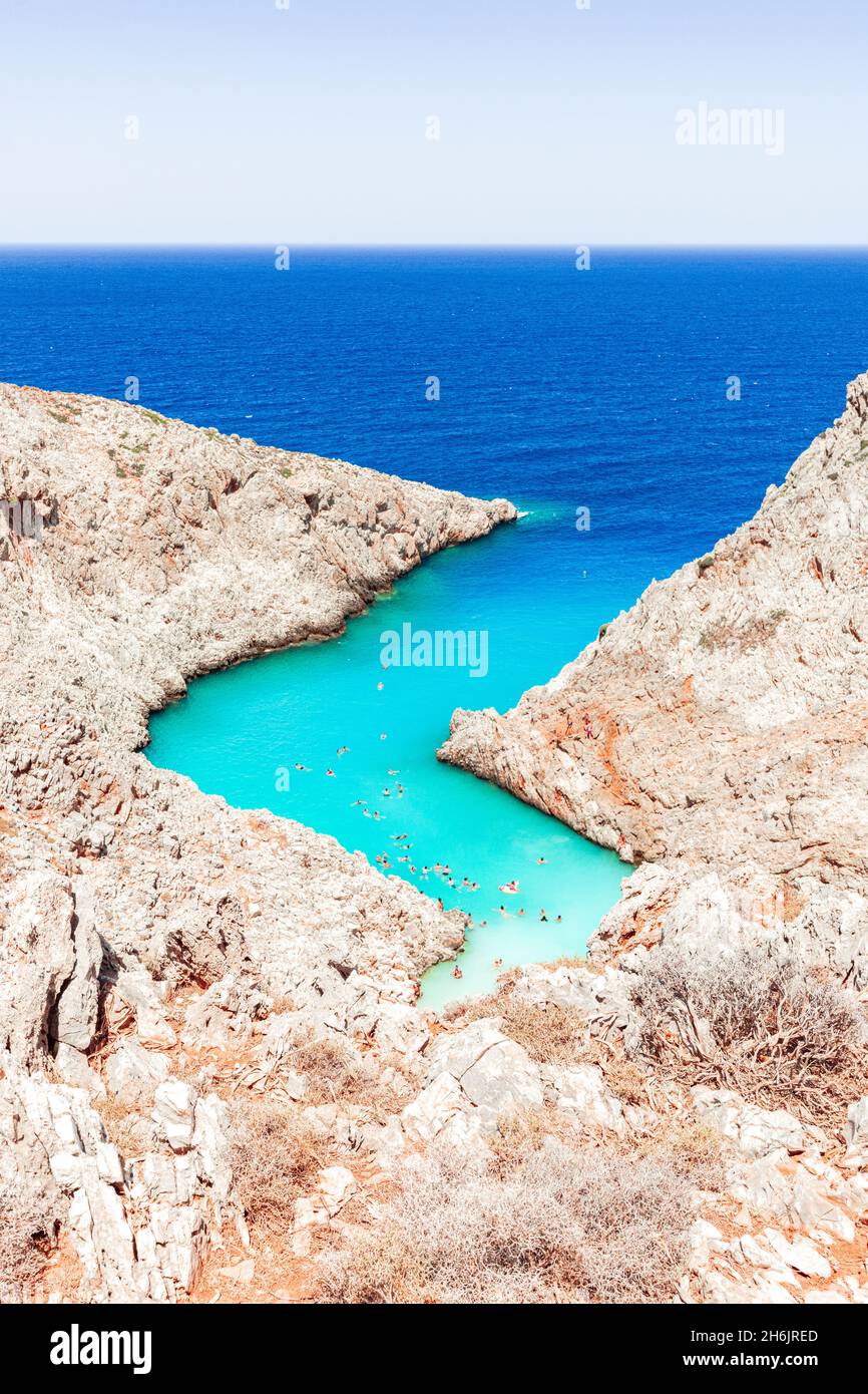 Beach of Seitan Limania washed by turquoise sea nestled inside rock canyons, Akrotiri peninsula, Chania, Crete, Greek Islands, Greece, Europe Stock Photo