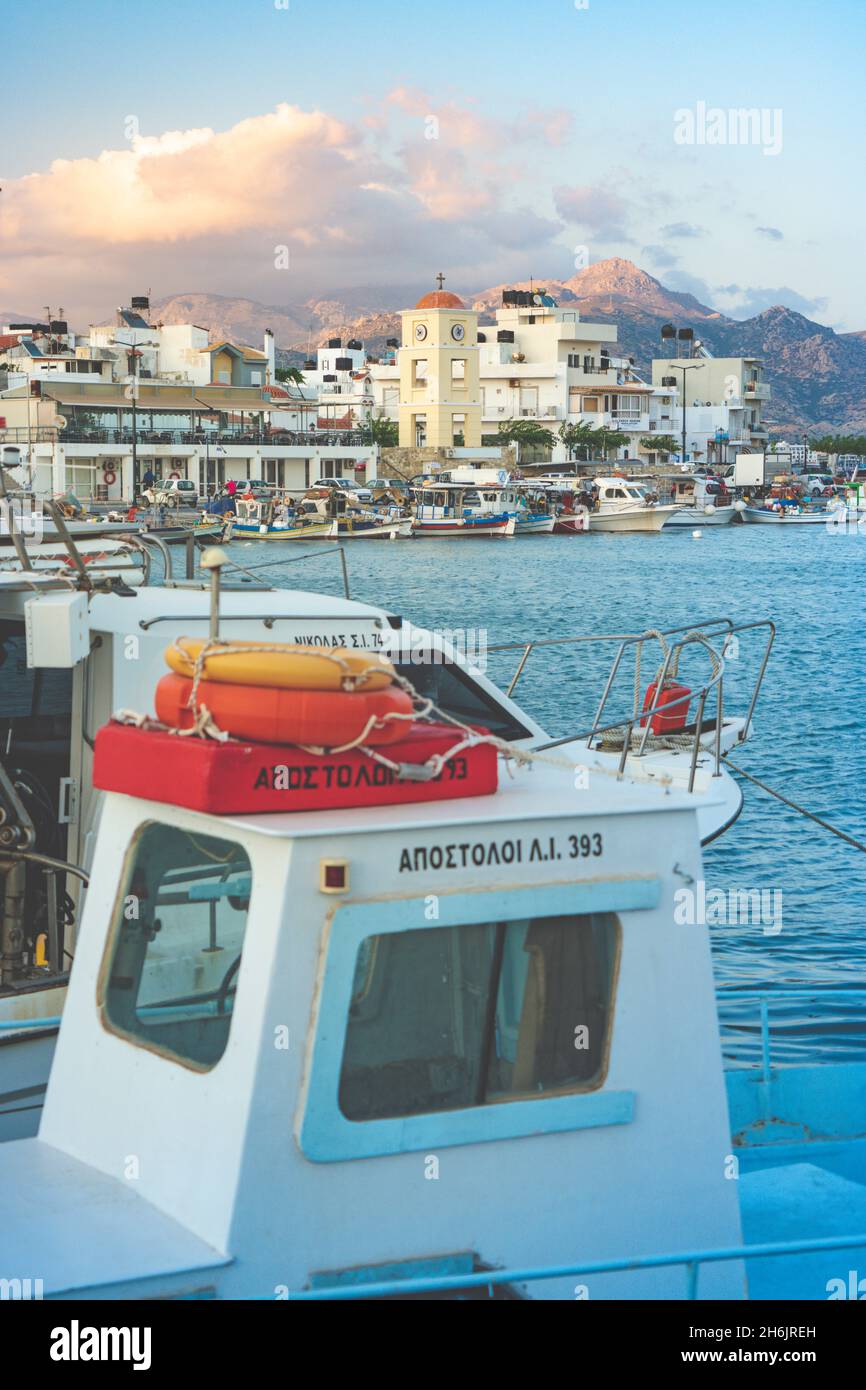 Fishing boats moored in the harbor of the seaside town of Ierapetra at sunset, Crete, Greek Islands, Greece, Europe Stock Photo