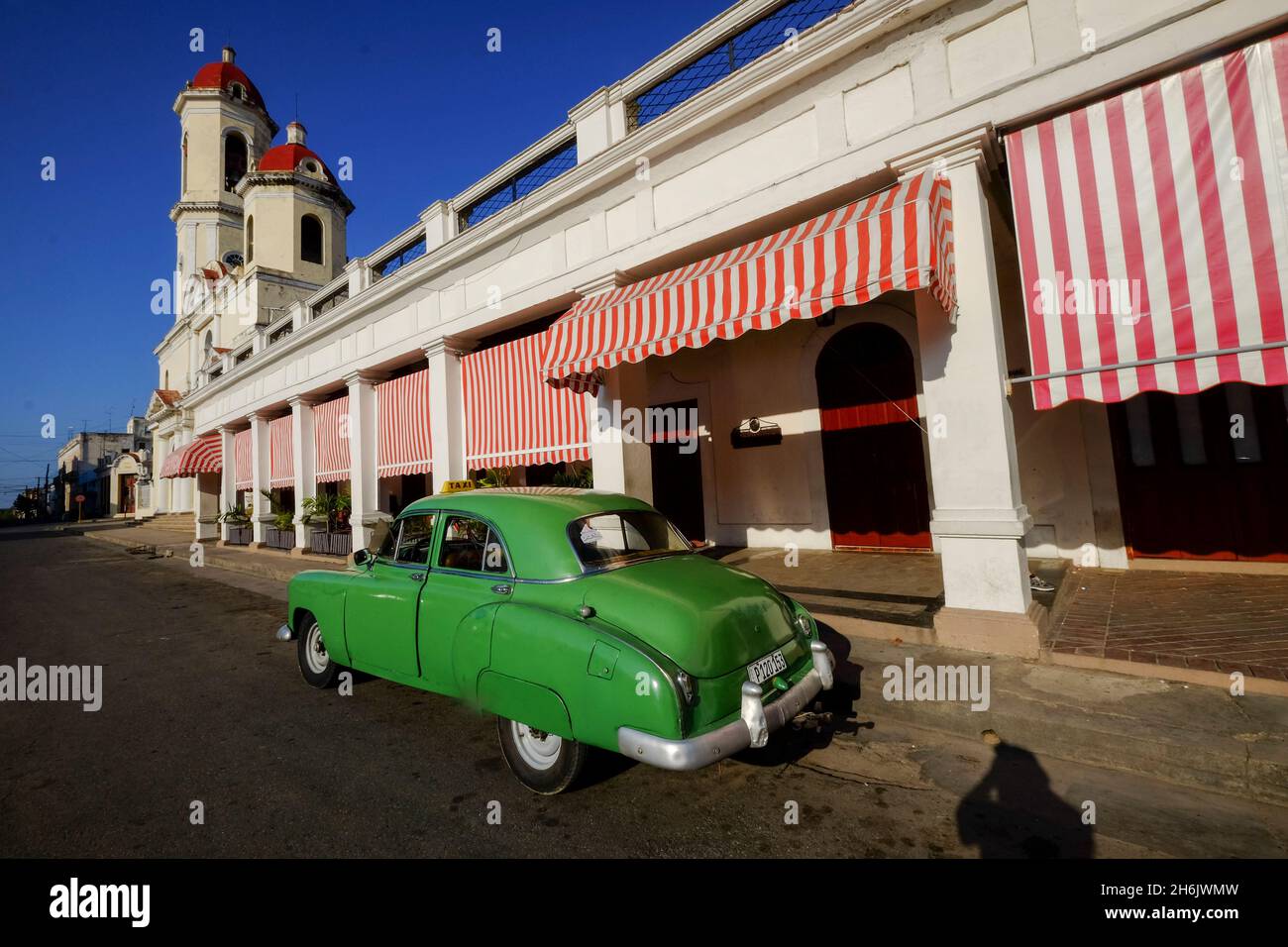 Vintage car parked along the street with Catedral de la Purisima Concepcion, Cienfuegos, USA, Cuba, West Indies, Central America Stock Photo