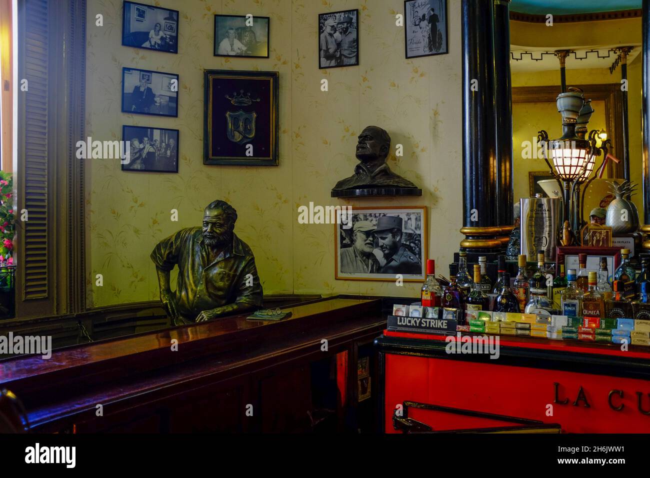 Sculpture of Ernest Hemingway sitting at the bar of the Floridita, Havana, Cuba, West Indies, Central America Stock Photo