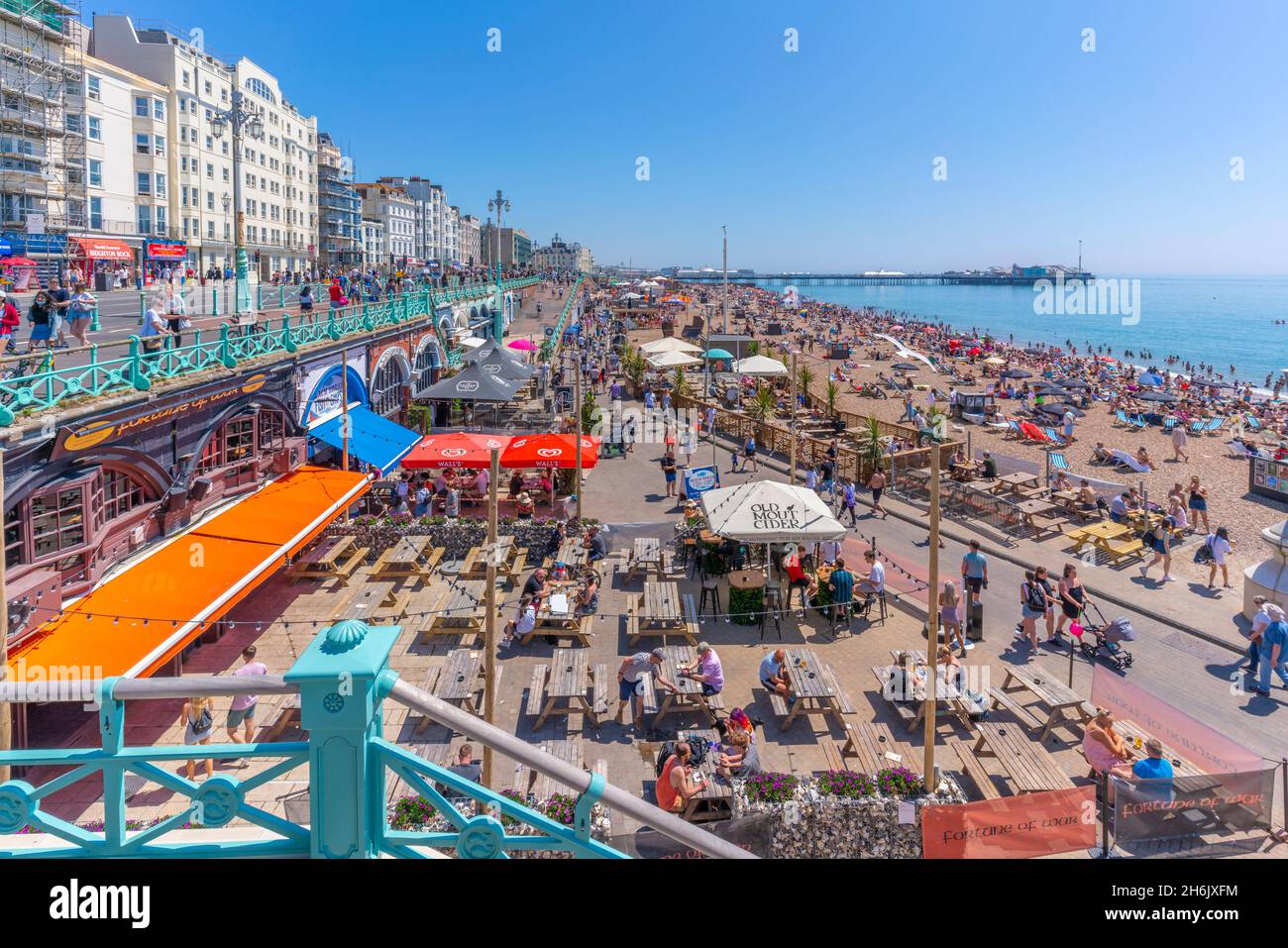 View of beach, seafront cafe and Brighton Palace Pier on a sunny day, Brighton, East Sussex, England, United Kingdom, Europe Stock Photo