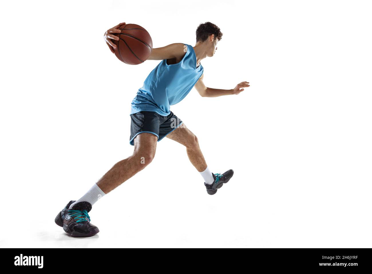 One professional basketball player in blue sports uniform training with