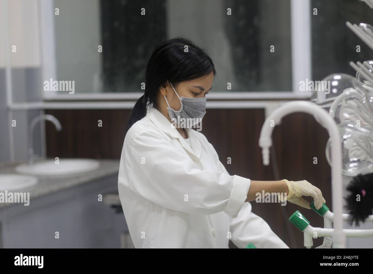 Asian woman scientist working in the laboratory Stock Photo