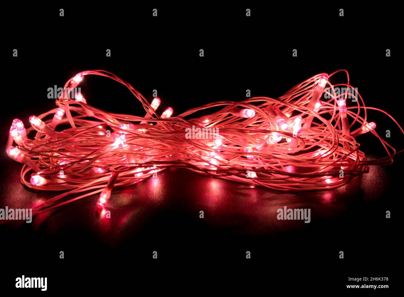 Light bulbs on dark background with selective focus Stock Photo