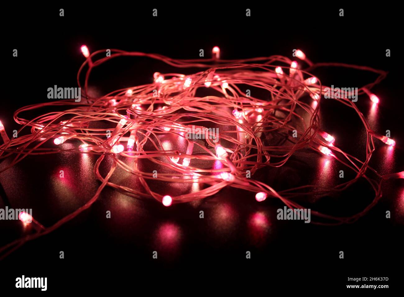 Light bulbs on dark background with selective focus Stock Photo