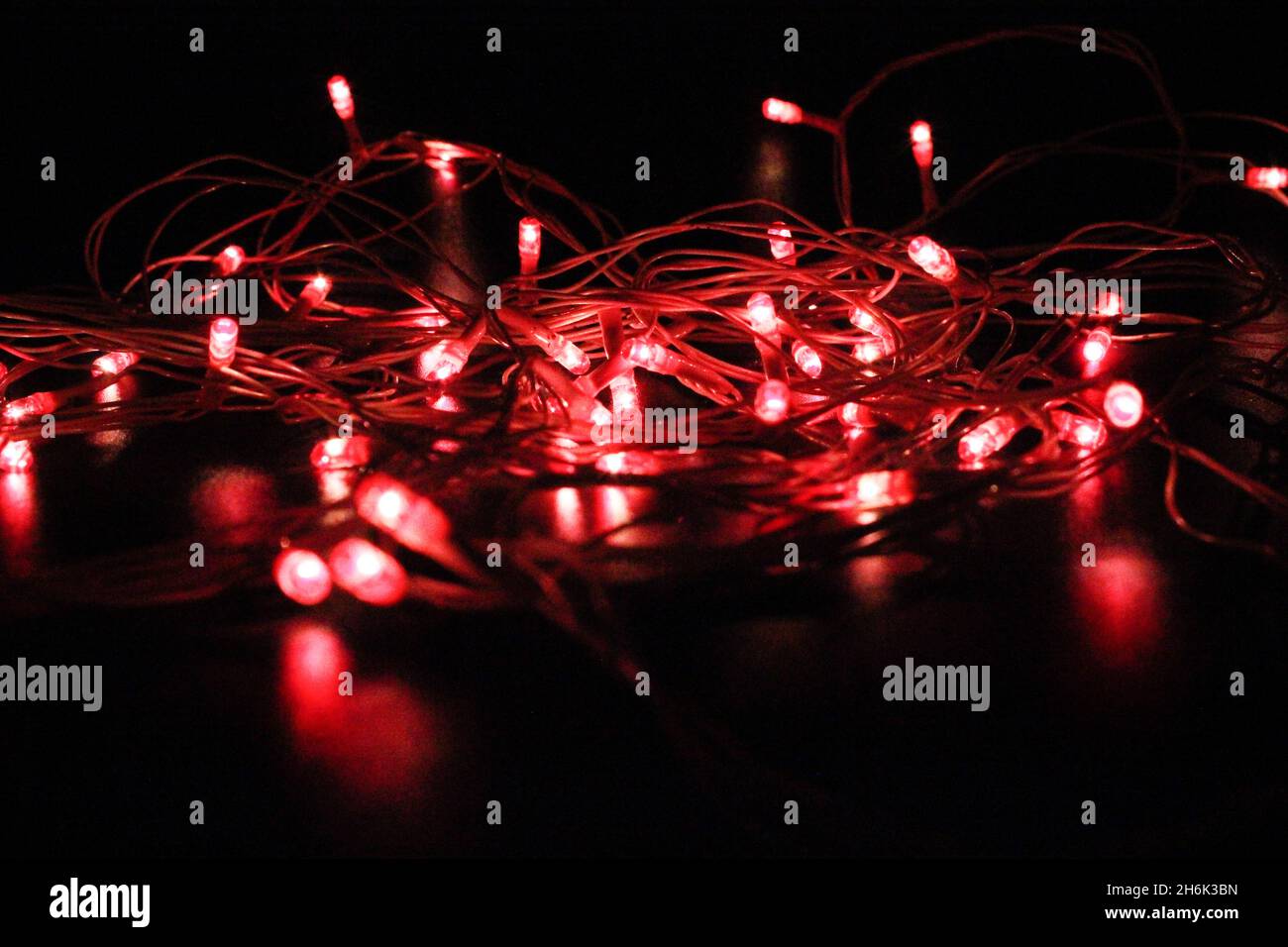 Light bulbs on dark background with selective focus Stock Photo