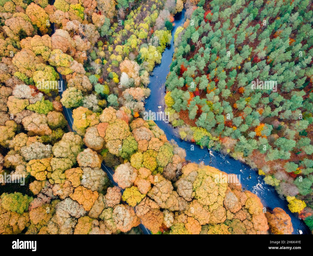 Magical colour full autumn road and river in Wicklow Mountains, Ireland Stock Photo