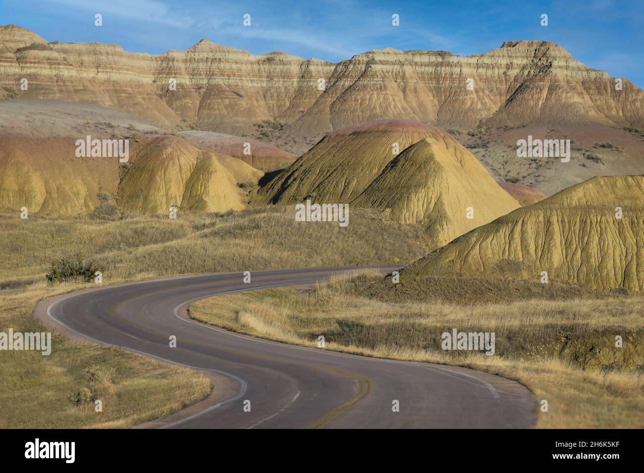 Road winds through the yellow mounds area in Badlands National Park