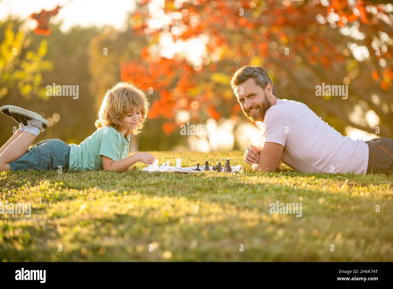 parenthood and childhood. checkmate. spending time together. strategic and tactic. Stock Photo
