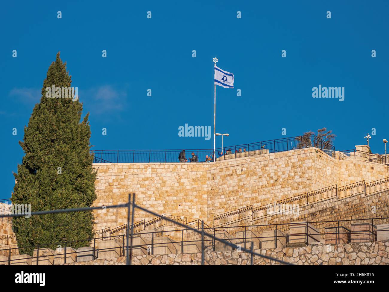 Israel, Jerusalem - January 13: Israeli national flag at Mount of Olives view point on January 13, 2020 in Jerusalem, Israel. Every inch of Jerusalem Stock Photo
