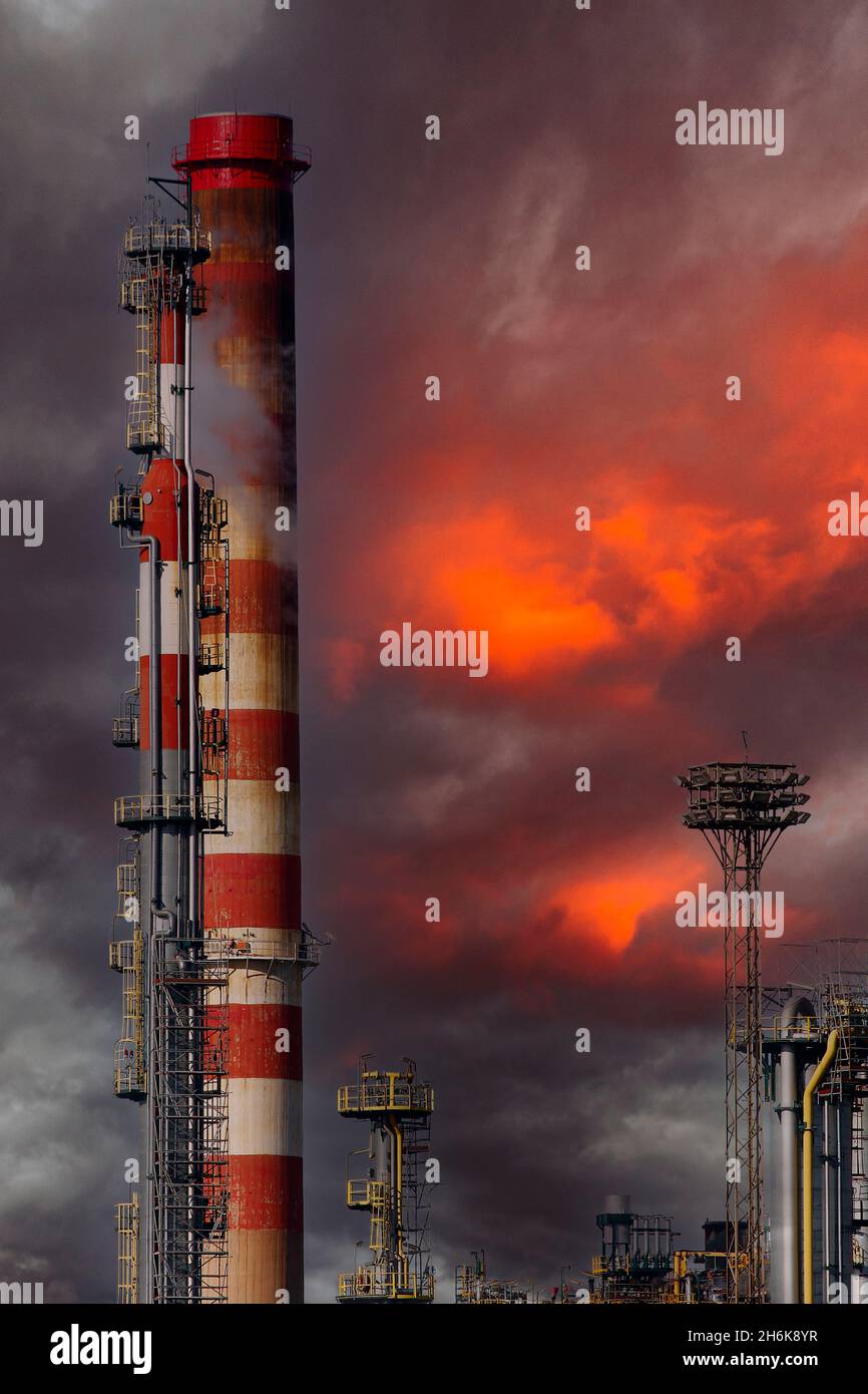 Large oil refinery complex, with chimneys and towers Stock Photo