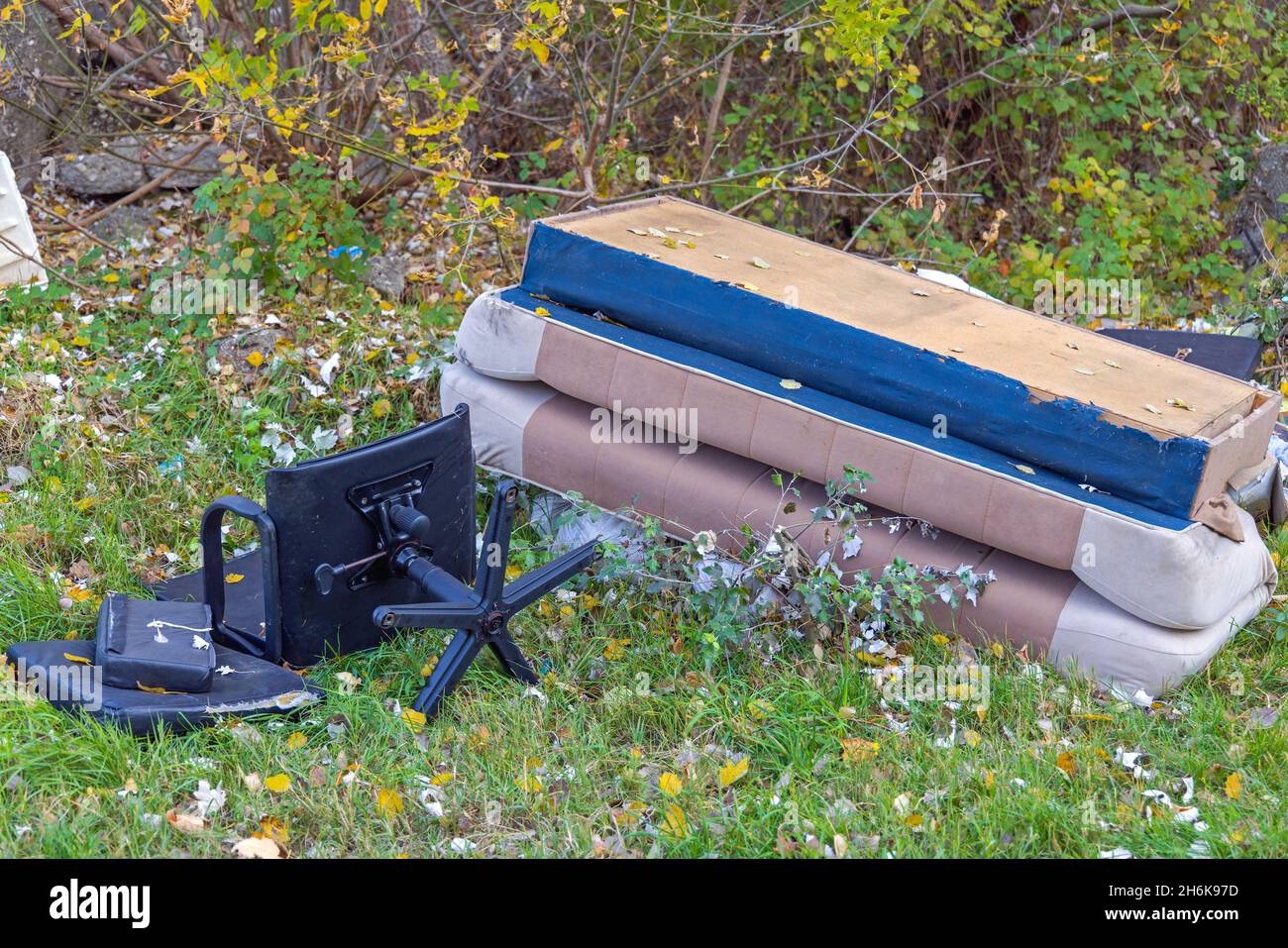 Illegal Furniture Dumping Site in Nature Environment Problem Stock Photo