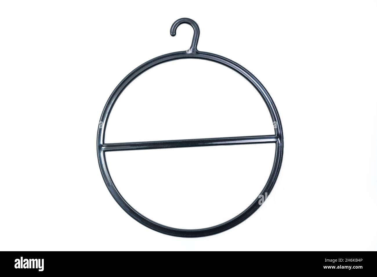 Black Round circular hanger isolated over white background with clipping path included. Plastic hanger for ties, scarves, jewelry Stock Photo