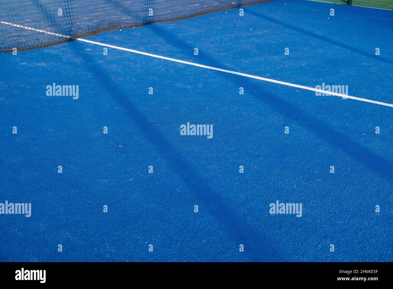 Blue paddle tennis court field with white lines background Stock Photo