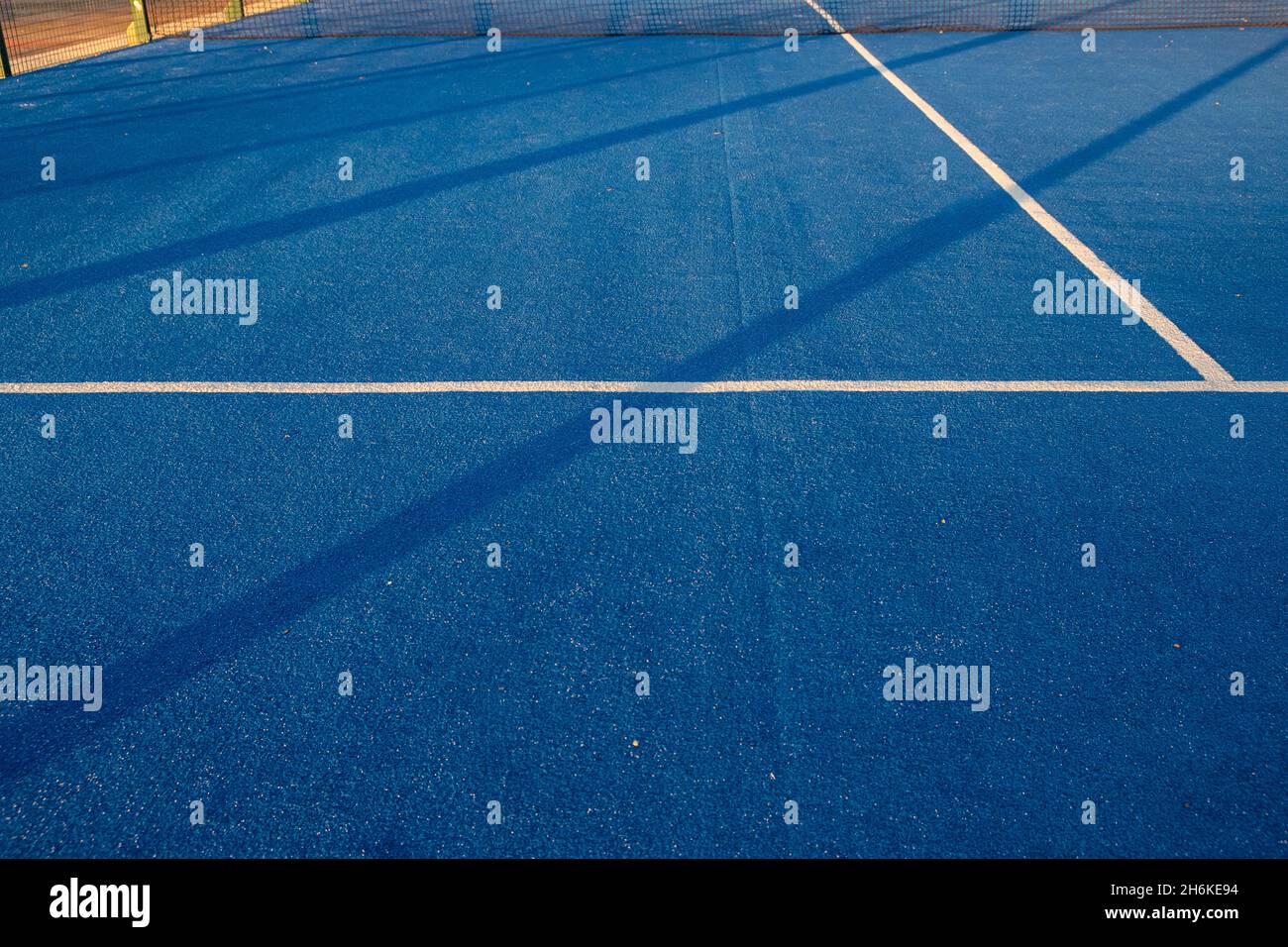 Blue paddle tennis court field with white lines background Stock Photo