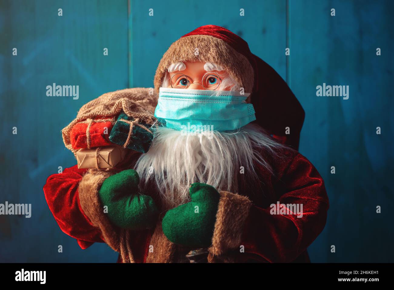 Santa Claus dummy toy with protective face mask for Covid-19 pandemics, selective focus Stock Photo