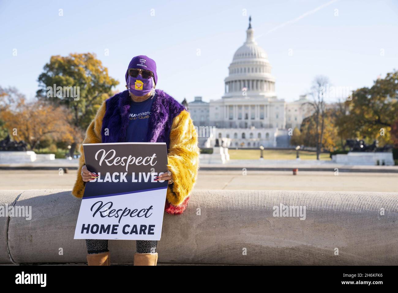 Washington, United States. 16th Nov, 2021. A woman attends a rally in support of the care economy investments in the Build Back Better agenda hosted by the National Domestic Workers Alliance, MomsRising, and the Service Employees International Union (SEIU) on the National Mall in Washington DC on Tuesday, November 16, 2021. Photo by Sarah Silbiger/UPI Credit: UPI/Alamy Live News Stock Photo